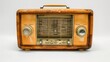 © Sasikharn - An old radio with a wooden case sits on a white background