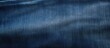 © Eyepain - Jeans dark blue wrinkled cloth fabric surface textured background