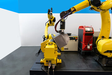 Leinwandbilder - Welding robot arms on a smart factory.
