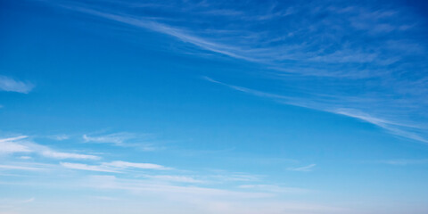 a serene blue sky with wispy clouds, suggesting calmness, ideal for backgrounds or meditation visual
