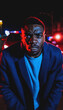 © Flash - photo of portrait close up view of criminal suspect in crime scene standing in front of police car at night and red blue light, generative AI