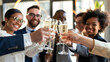 © Skip Monday - successful entrepreneur celebrating a business milestone with colleagues, toasting to their achievements with champagne