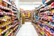 © MonicaPriscilla - blur Row aisle list of famous well known brand cheap candies and snack rack at 24 hour open convenient store souvenir supermarket mini market chain in south east asia Surabaya, Indonesia