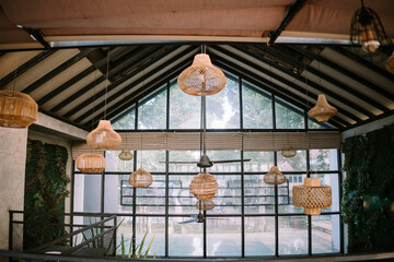 Decorative lights adorning the wall of a restaurant building, casting a warm and inviting glow, creating a cozy ambiance for diners