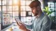 © Plaifah - Entrepreneur examining a graph on a smartphone, showcasing business analytics and mobile work flexibility.