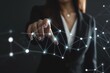 © SQUAREPIXEL - Businesswoman in suit touching virtual