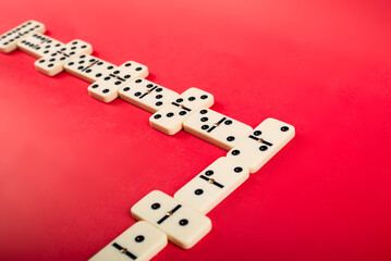 Wall Mural - Dominoes with red background, copy space and various angles