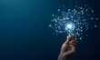 © MD - Hand Holding Light Bulb with Digital Connections on Dark Blue Background