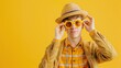 © aldi - Young man dons disguise, bringing laughter to April Fools' Day celebration against bright yellow background