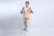 © Queenmoonlite Studio - Full Body Of Stylish Young Asian Guy Giving Thumbs Up Isolated On White Background
