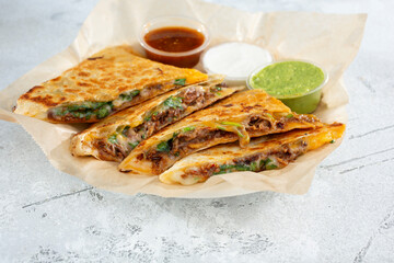 Wall Mural - A view of a beef birria quesadilla.