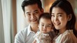 © R Studio - Happy Thai family portrait with parents and young daughter, highlighting love and unity, perfect for family-oriented promotions and lifestyle content
