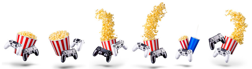 Canvas Print - Flying popcorn and video game joystick gamepad isolated on a white background