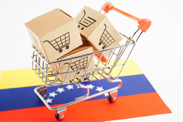 Online shopping, Shopping cart box on Colombia flag, import export, finance commerce.