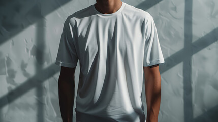 Wall Mural - White T-Shirt Worn by Model with Shadowed Background, Mocup