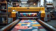© Алина Бузунова - Colorful high-resolution photo of a large format wide-angle vinyl wrap printer in action, printing colorful geometric patterns on fabric and plastic materials