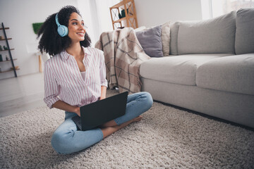 Sticker - Full length photo of shiny cute girl dressed white striped shirt headphones enjoying songs texting modern gadget indoors house apartment room