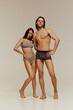 © master1305 - Fit male and female models showcasing casual and comfortable underwear collection. Young girl and handsome boy with sportive bodies. Concept of beauty, body, sport and health, fashion