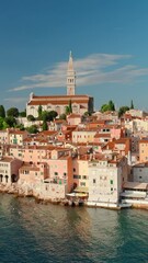 Wall Mural - Aerial view of the Rovinj old town at sunset, famous ancient Croatian city at the Adriatic sea, Istria peninsula, Croatia. Rovinj cityscape, cathedral of St. Euphemia and historic buildings