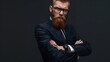 © Felippe Lopes - Confident young man with a stylish beard and glasses wearing a suit, arms crossed, looking serious against a dark background.