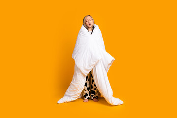 Poster - Full length photo of adorable lovely cute woman wrapped warm blanket isolated on yellow color background