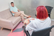 © Oscar - Visit to a psychologist. A man sits on a couch and talks to a psychotherapist. The patient is depressed, apathetic and stressed from problems in his personal life. Help of a psychologist.