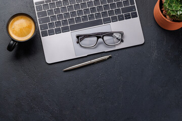 Wall Mural - Office desk table with laptop, cup of coffee and supplies