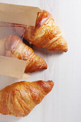 Wall Mural - Croissants in a paper bag