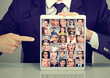 © pathdoc - Business man with tablet advertising photo collection group of multicultural diverse people