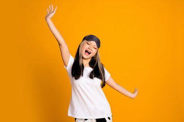 Poster - Photo of adorable charming sleepy woman wear white trendy pajama raised hands isolated on yellow color background