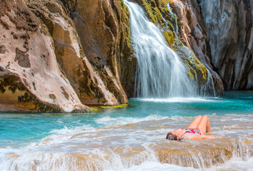 Poster - Deep forest Waterfall - Pebbles rocks underwater below Alara Ucansu waterfall with surface in shallow water - Antalya, Turkey