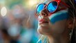 © Photolife   - portrait of a beautiful fan of the French national team with the colors of the team on her face and clothes. fan of the French national team at the stadium