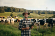 © Di Studio - Man farmer with tablet computer in the field with cows