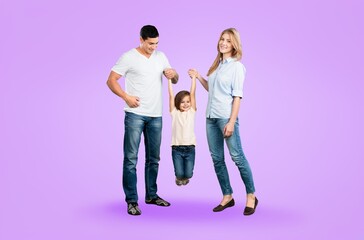 Wall Mural - young parents and cute child hold hands walk