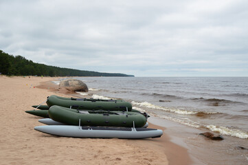 Wall Mural - Rubber boats on lake shore.