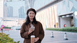 © zhouyilu - Confident Young Professional Enjoying Coffee Break Outdoors