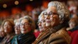 © marimalina - A group of audience members in the opera house listened with rapt attention