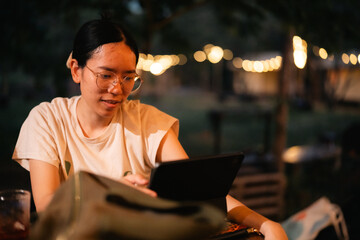 Late-night freelancer, Dedicated Asian woman working overtime on laptop computer, meeting deadlines in the sleepy Night, Businesswoman burning the midnight to working hard, sleep at working desk