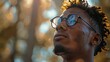 © kanesuan - Man with vitiligo and natural hair enjoying the outdoors