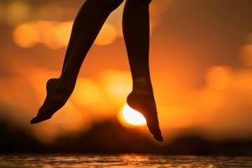 Silhouette of dancer's legs at sunset showcasing graceful movement and beauty