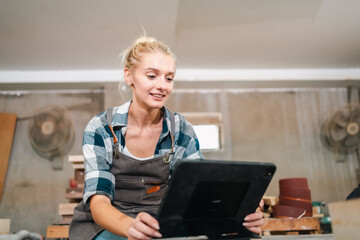 Wall Mural - professional artisan carpenters woodworking team work together creatively, creative carpenter woman working workshop for wooden craft with wood tool at industry carpenter's shop, business of wood