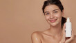 © Oleksiy - Woman with bottle of care product and cleansing foam on beige background, closeup. Space for text