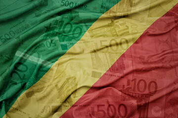 Wall Mural - waving colorful national flag of republic of the congo on a euro money banknotes background. finance concept.