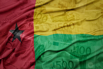 Wall Mural - waving colorful national flag of guinea bissau on a euro money banknotes background. finance concept.