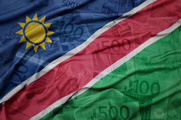 Wall Mural - waving colorful national flag of namibia on a euro money banknotes background. finance concept.