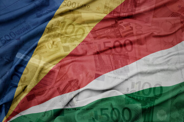 Wall Mural - waving colorful national flag of seychelles on a euro money banknotes background. finance concept.