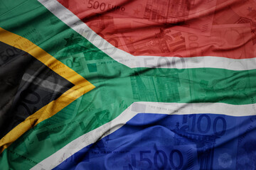 Wall Mural - waving colorful national flag of south africa on a euro money banknotes background. finance concept.