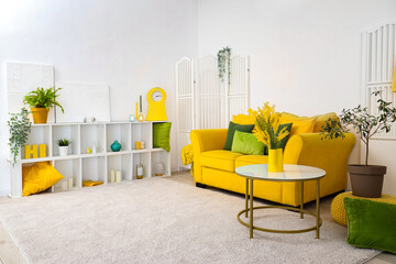Wall Mural - Interior of stylish living room with yellow sofa, table and shelf unit