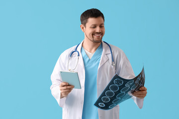 Sticker - Male doctor with MRI scan and tablet computer on blue background