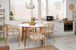 © Pixel-Shot - Interior of stylish kitchen with dining table, chairs and lamp